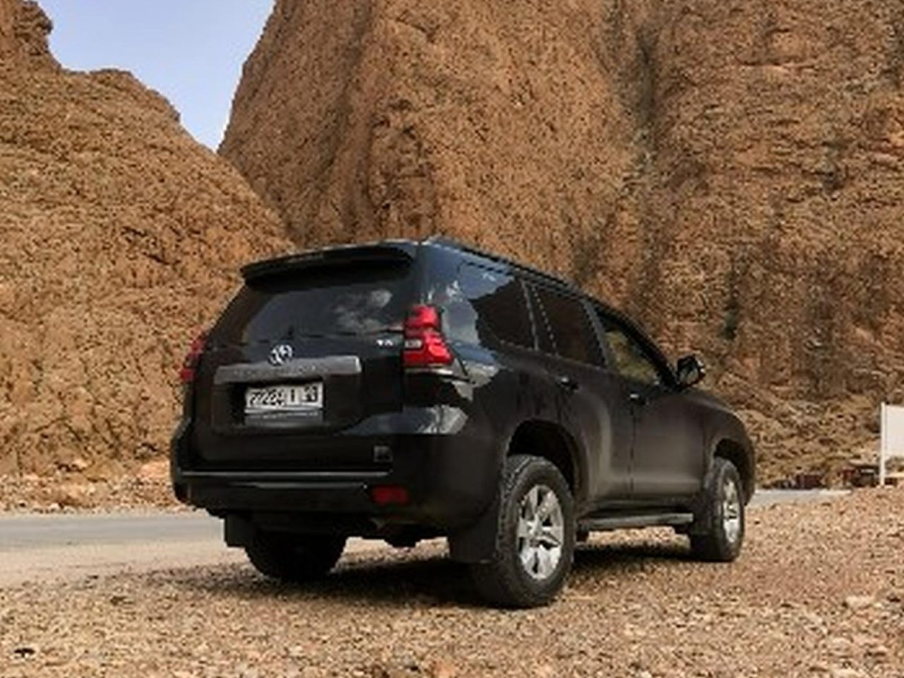 4x4 vehicle driving through the rugged Dades Valley Gorge in southern Morocco